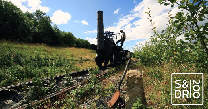 man driving replica of Locomotion No1 engine on the historic Stockton and Darlington Railway line.
